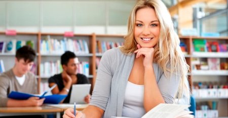 Young college student studying in library Young college student studying in library